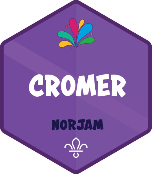 A purple badge for the Cromer staff subcamp, with a subtle Norfolk flag design in the background and text that reads 'Cromer' and 'Norjam'.